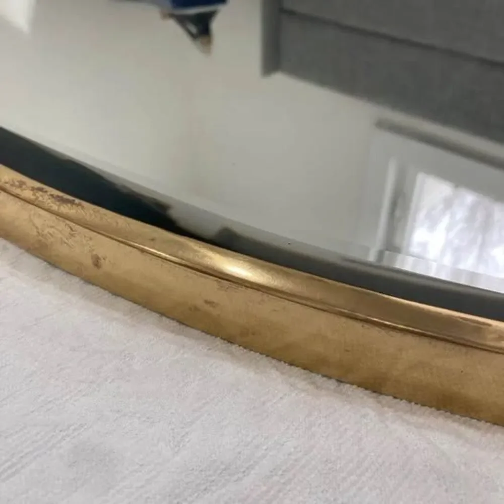 Pottery Barn brass shield shaped wall mirror